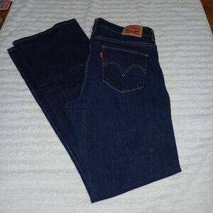 NWOT, Levis, size 8, dark blue jeans.